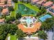 Aerial view of the community pool and lake with fountain at 4244 Messina Dr, Lake Mary, FL 32746