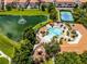 The community amenities include a sparkling pool, playground, and a serene lake with a fountain at 4244 Messina Dr, Lake Mary, FL 32746