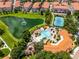 An aerial image of the community pool and tennis courts next to the lake at 4244 Messina Dr, Lake Mary, FL 32746
