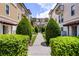 Beautifully landscaped walkway between townhomes, creating a serene and inviting community atmosphere for residents at 4244 Messina Dr, Lake Mary, FL 32746
