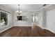 Open dining room with hardwood floors, pendant lighting, and easy kitchen access at 4244 Messina Dr, Lake Mary, FL 32746