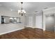 Hardwood dining room with pendant lighting, and kitchen bar access at 4244 Messina Dr, Lake Mary, FL 32746