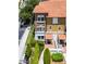Multi-story townhome featuring a red tile roof and well-maintained landscaping at 4244 Messina Dr, Lake Mary, FL 32746