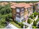 Charming townhome with a tile roof, colorful accents, and meticulously landscaped greenery at 4244 Messina Dr, Lake Mary, FL 32746