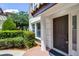 Front entrance with a dark brown front door and landscaping at 4244 Messina Dr, Lake Mary, FL 32746