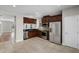 Open kitchen featuring stainless steel appliances and dark wood cabinets at 4244 Messina Dr, Lake Mary, FL 32746