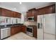 Well-equipped kitchen with stainless appliances, dark cabinets and granite countertops at 4244 Messina Dr, Lake Mary, FL 32746