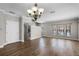 Bright living room with hardwood floors, stairs, and large windows at 4244 Messina Dr, Lake Mary, FL 32746