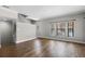 Bright living room with hardwood floors and natural light from large windows at 4244 Messina Dr, Lake Mary, FL 32746