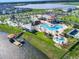 Aerial view of a community pool, lazy river, and lake at 4973 Windermere Ave, Kissimmee, FL 34746