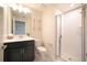 Bathroom with walk-in shower, vanity, and ample lighting offering a clean and functional space at 4973 Windermere Ave, Kissimmee, FL 34746