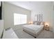 Inviting bedroom featuring soft carpet, neutral tones, and ample natural light creating a peaceful retreat at 4973 Windermere Ave, Kissimmee, FL 34746