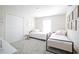 Clean bedroom with two single beds, closet, soft carpet, and decorations creating a cozy and inviting space at 4973 Windermere Ave, Kissimmee, FL 34746