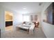 Comfortable bedroom featuring a bed, side tables, and bathroom entrance at 4973 Windermere Ave, Kissimmee, FL 34746