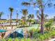Mini golf course surrounded by lush greenery and mature palm trees at 4973 Windermere Ave, Kissimmee, FL 34746