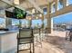 Outdoor bar area with bar seating, multiple televisions and an open design at 4973 Windermere Ave, Kissimmee, FL 34746