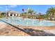 Community splash pad featuring colorful buckets, sprayers, and tiled patio at 4973 Windermere Ave, Kissimmee, FL 34746
