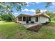 Expansive backyard with mature trees, patio and a screened lanai at 5237 Gateway Ave, Orlando, FL 32821
