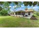 Lush backyard with a tiled roof and a screened lanai at 5237 Gateway Ave, Orlando, FL 32821
