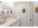 Bathroom with white countertops, cabinets, and large mirror at 5237 Gateway Ave, Orlando, FL 32821