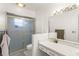Bathroom with glass enclosed shower, vanity, and storage at 5237 Gateway Ave, Orlando, FL 32821