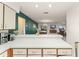 Open concept kitchen flows into dining area with views of the living room and backyard at 5237 Gateway Ave, Orlando, FL 32821