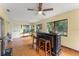 Open living room with bar, seating, and bright natural light at 5237 Gateway Ave, Orlando, FL 32821