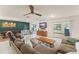 Inviting living area with tile flooring, stylish furniture, and a ceiling fan for added comfort at 5237 Gateway Ave, Orlando, FL 32821