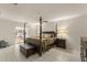 Spacious main bedroom with a four-poster bed and sliding glass doors for natural light at 5237 Gateway Ave, Orlando, FL 32821