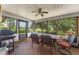 Enclosed porch with outdoor dining set and screened windows at 5237 Gateway Ave, Orlando, FL 32821