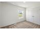 A bedroom with neutral carpet, a window, and a closet offers a peaceful retreat at 667 Bay Leaf Dr, Kissimmee, FL 34759