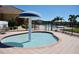 A community pool features a fun mushroom water feature and a view of the community at 667 Bay Leaf Dr, Kissimmee, FL 34759