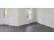 A bright room with wood-style flooring, a door and large window provides a flexible living space at 667 Bay Leaf Dr, Kissimmee, FL 34759