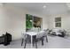 Covered patio featuring modern outdoor seating and dining area at 7212 Nottingham Reel Ct, St Cloud, FL 34773