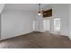 Spacious bedroom with a ceiling fan, wood-look floors, walk-in closet, and a rustic accent wall at 762 Lake Como Dr, Lake Mary, FL 32746