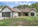 Charming single-story home with neutral paint, manicured lawn, and attached two-car garage at 762 Lake Como Dr, Lake Mary, FL 32746
