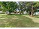 A charming single-story home featuring a well-manicured lawn and mature trees offering shade at 762 Lake Como Dr, Lake Mary, FL 32746
