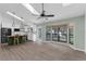 Open floor plan with kitchen, butcher block island, and bay window looking out to trees at 762 Lake Como Dr, Lake Mary, FL 32746