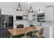 Modern kitchen with white subway tile, butcher block island, and stainless steel appliances at 762 Lake Como Dr, Lake Mary, FL 32746