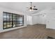 Bright living room with large window, wood floors, and white walls at 762 Lake Como Dr, Lake Mary, FL 32746