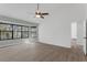 Bright bedroom with large windows, neutral walls, and wood floors at 762 Lake Como Dr, Lake Mary, FL 32746