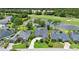 Aerial view of a neighborhood with golf course and pond views, showcasing prime real estate at 856 Bentley Green Cir, Winter Springs, FL 32708