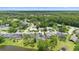 Stunning aerial view of a residential neighborhood with lush green trees and well-maintained homes at 856 Bentley Green Cir, Winter Springs, FL 32708