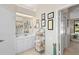 Bathroom featuring a large mirror, vanity with storage, and decorative shelving for linens and accessories at 856 Bentley Green Cir, Winter Springs, FL 32708