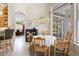 Breakfast nook features a light-filled window view, table set for four, and access to kitchen and bar seating at 856 Bentley Green Cir, Winter Springs, FL 32708