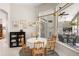 Bright breakfast nook featuring a Tiffany-style chandelier and views of outdoor kitchen and seating at 856 Bentley Green Cir, Winter Springs, FL 32708