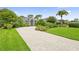 Charming home with lush landscaping and a large paver driveway at 856 Bentley Green Cir, Winter Springs, FL 32708
