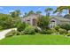 Charming home with lush landscaping and an inviting entrance, creating excellent curb appeal at 856 Bentley Green Cir, Winter Springs, FL 32708