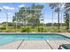 Screened-in pool with a view of the well-manicured backyard and golf course beyond at 856 Bentley Green Cir, Winter Springs, FL 32708