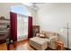 Inviting sitting room with hardwood floors, a large window, and comfortable seating at 856 Bentley Green Cir, Winter Springs, FL 32708